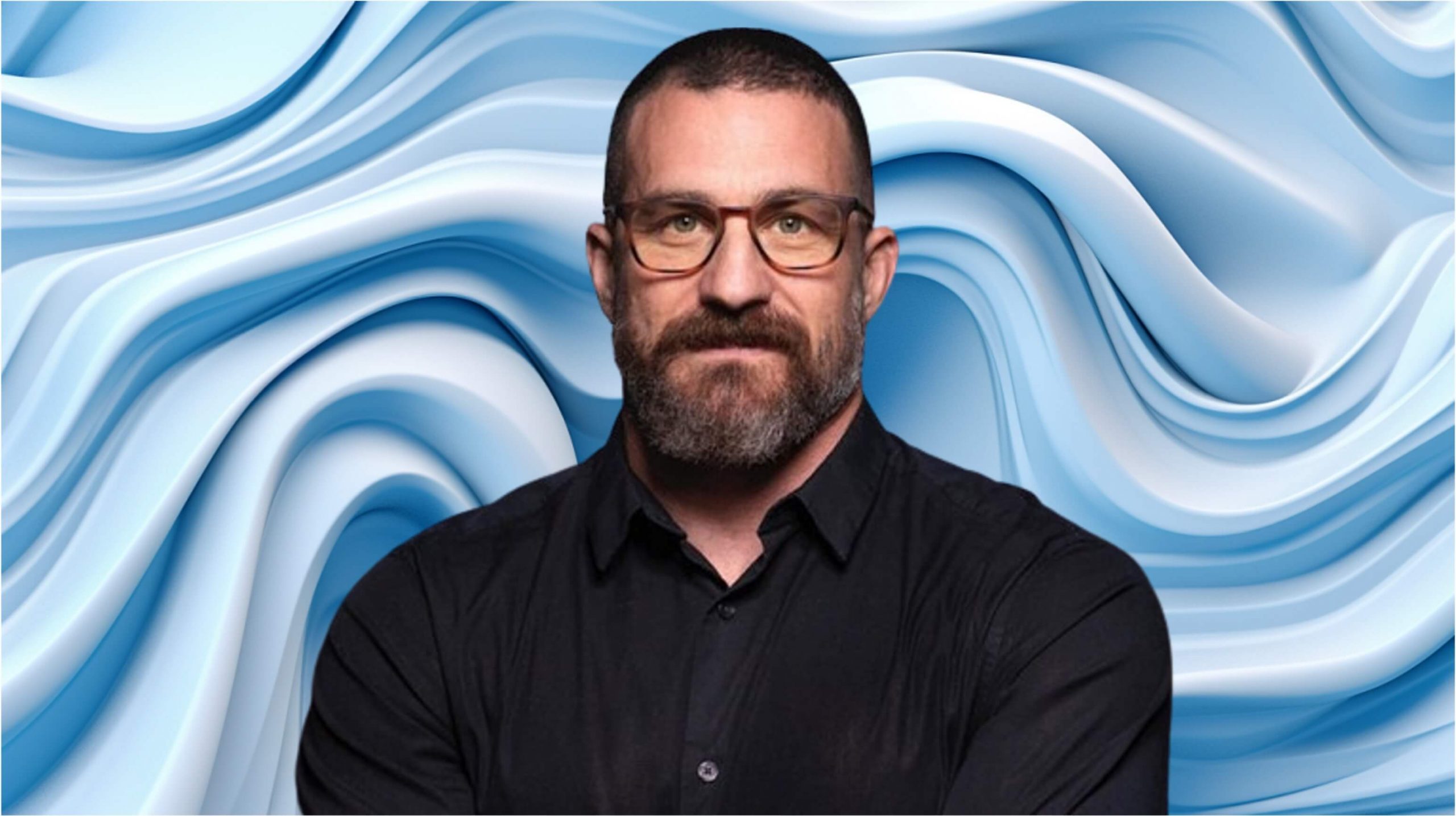 Andrew Huberman wearing glasses.