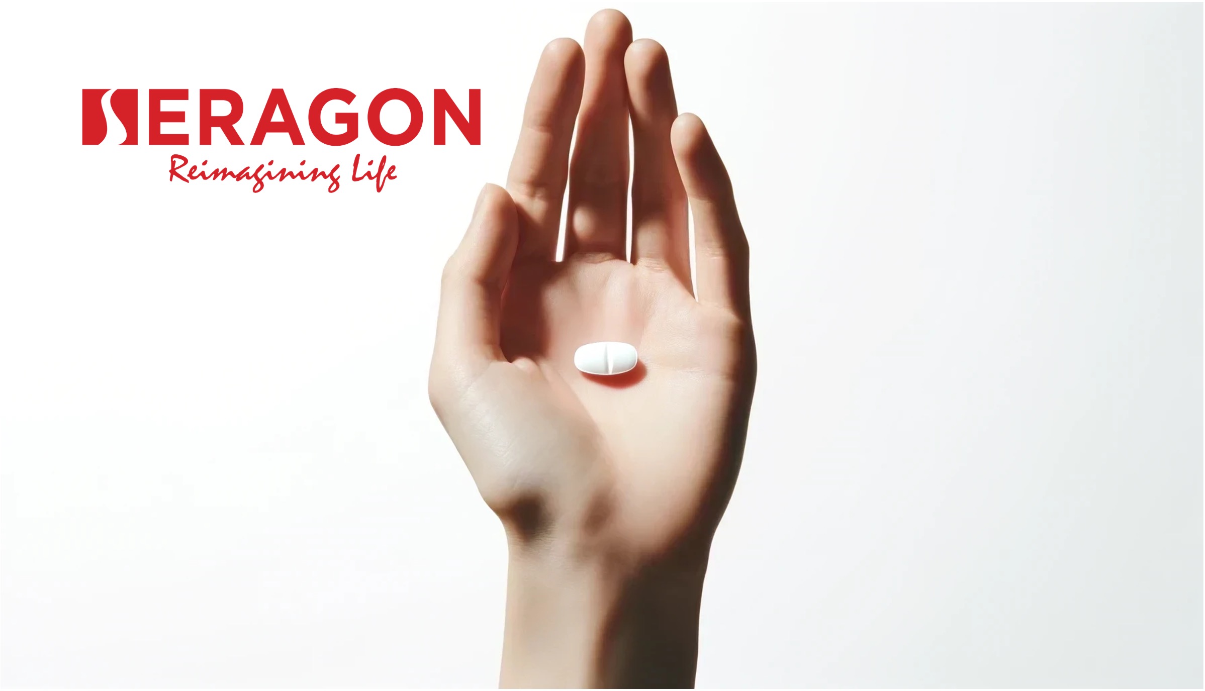 A hand with a white tablet in the palm. The Seragon logo is shown.