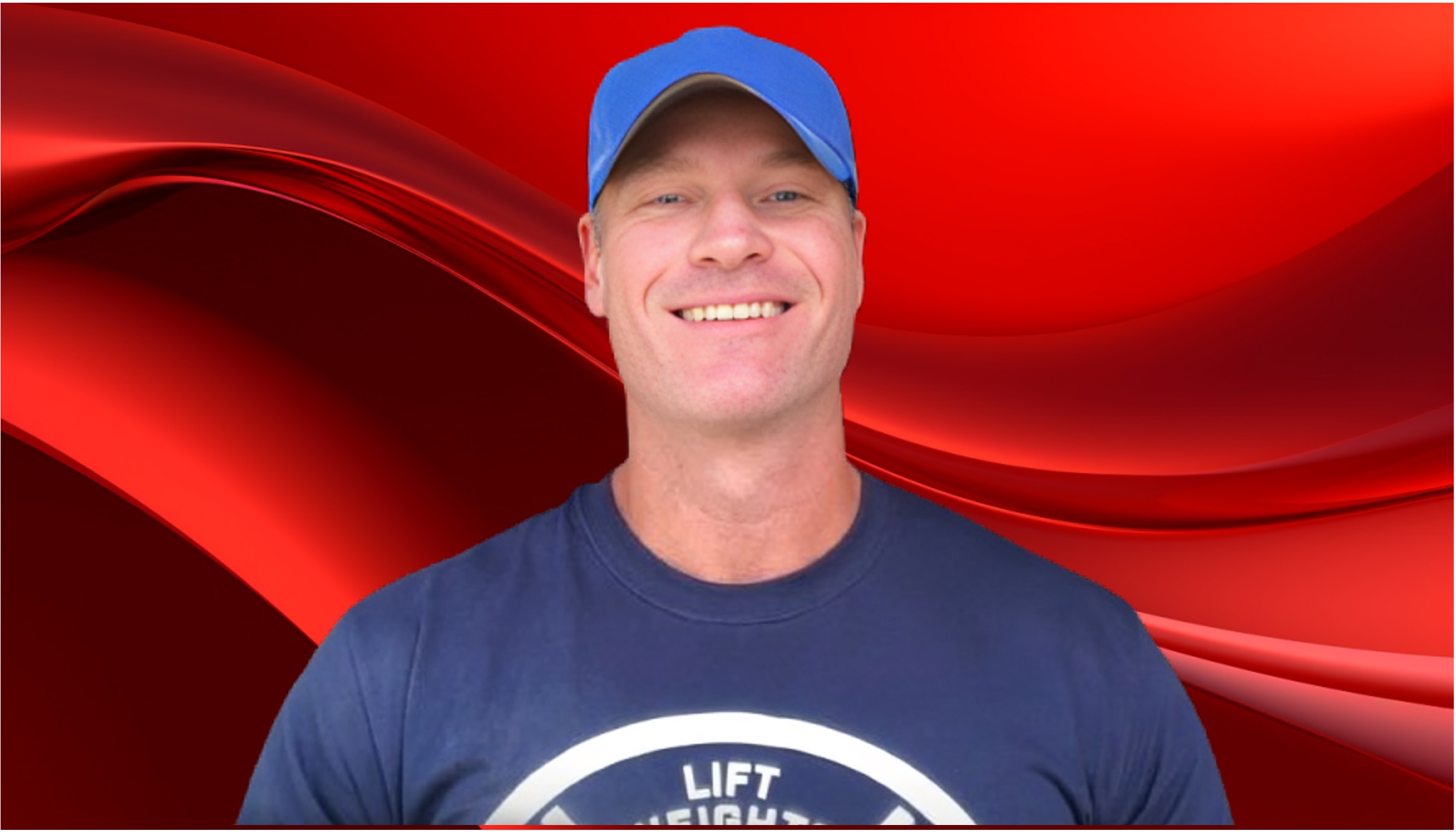 Shawn Baker smiling and wearing a blue shirt and hat.