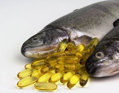 An image of fish oil capsules alongside two fish
