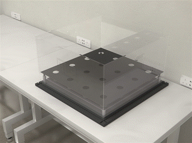 A device for the holeboard test, with holes that the mouse can poke its head out of for exploration
